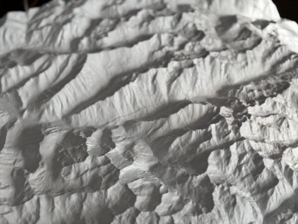 Close-up of ridges and valleys in a white 3D printed terrain map